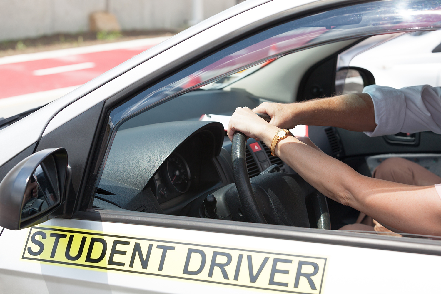 A student in a student driver car