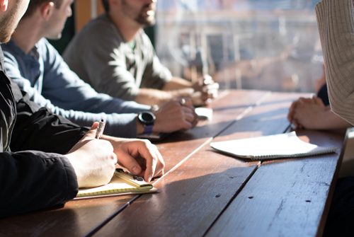 Board meetnig around a table 